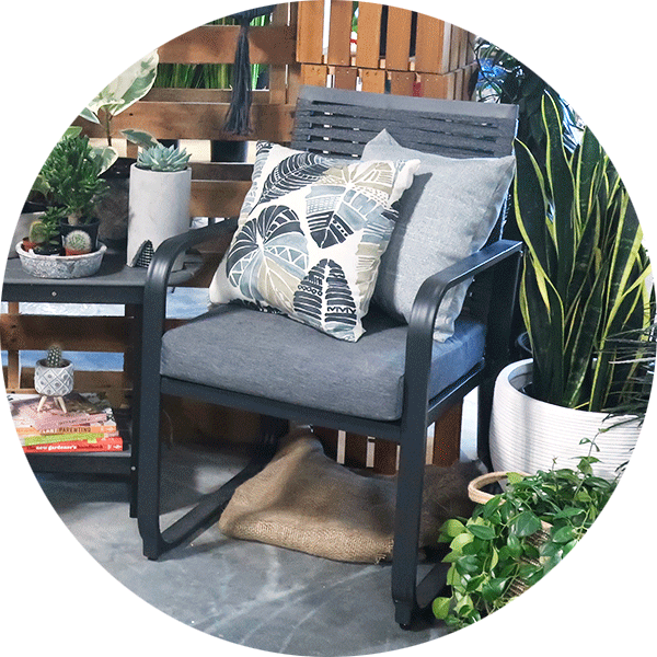 Chair with a black metal frame and dark gray cushion and back